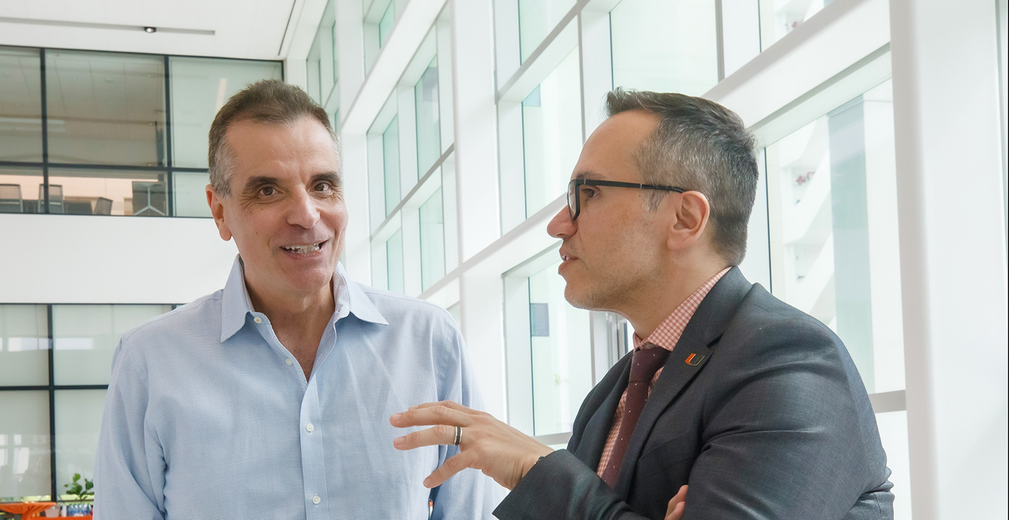 IDSC Director Nicholas "Nick" Tsinoremas chatting with Provost Guillermo "Willy" Prado at inaugural University of Miami IDSC Day