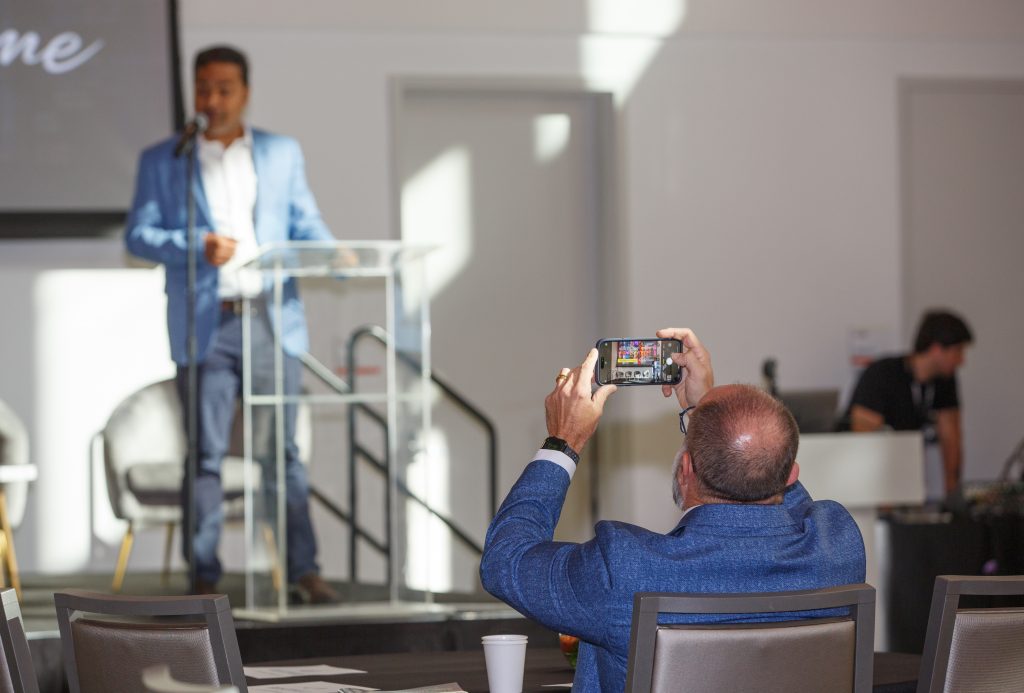 Dean Rodolphe el-Khoury photographs Dr. Sarbeswar Praharaj as he hosts his first Smart Cities MIAMI Conference
