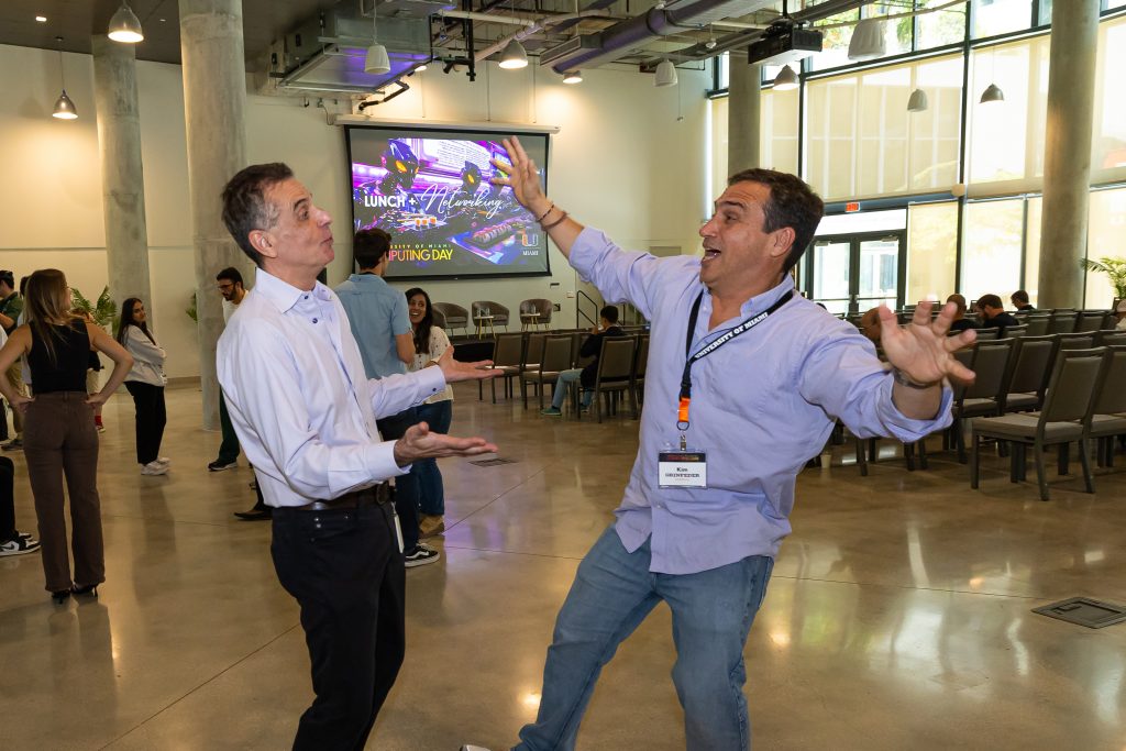 At the end of Computing Day, IDSC Director Dr. Nick Tsinoremas has some fun winding down with University UMverse Lead and Director of IDSC Creative Technologies program Kim Grinfeder 