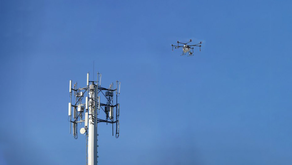 5G tower next to flying drone